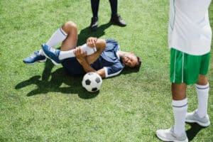 injured football player, run on medical team